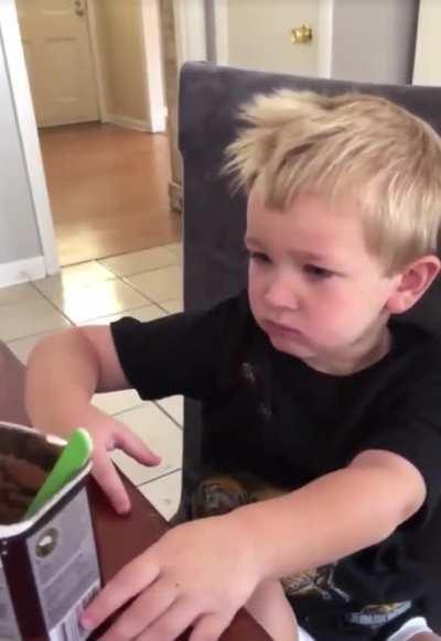 Kid eats chocolate powder