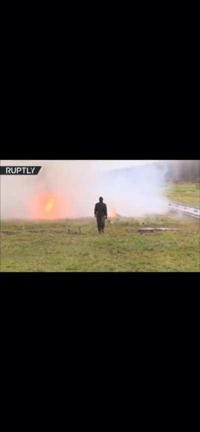 Woman walks through mine field with new suit of armour in Russia..