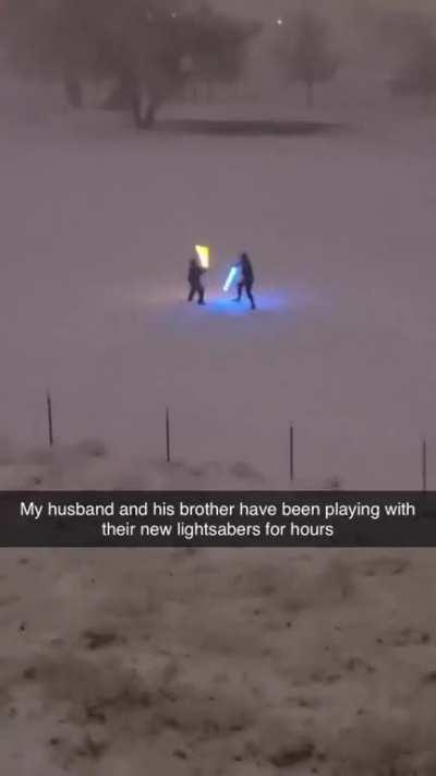 Chads having a lightsaber duel in the snow