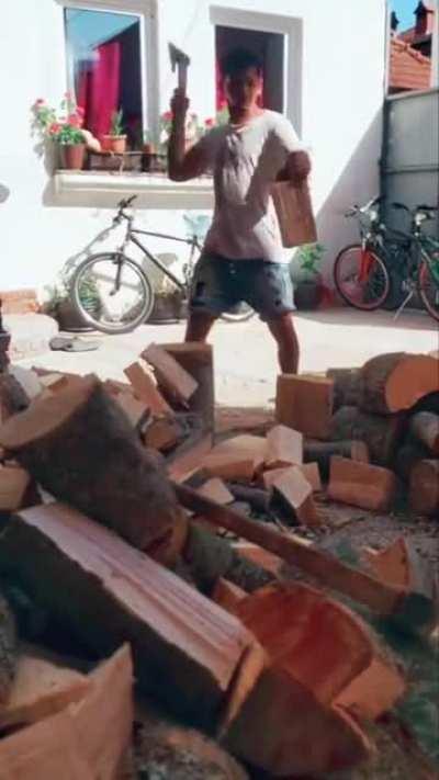 the man is very professional in cutting wood