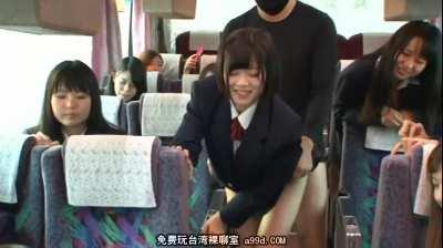 Students play cards on the bus