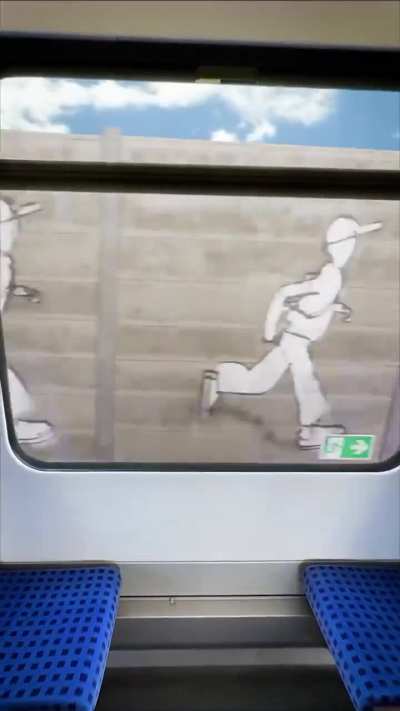 Static images on a wall that appear animated as Train moves.