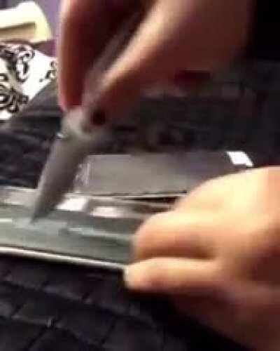 WCGW Trying to slice a battery open