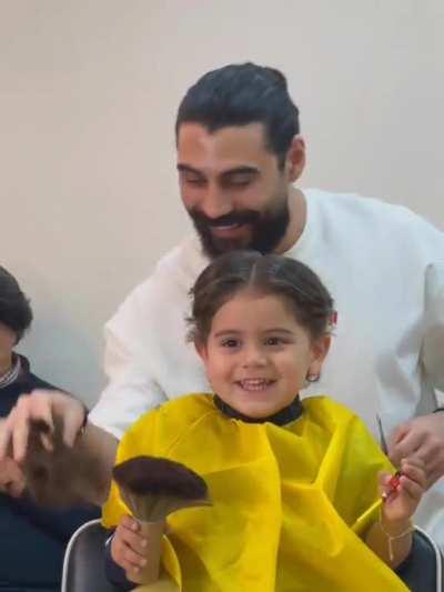 Enjoys getting a haircut.