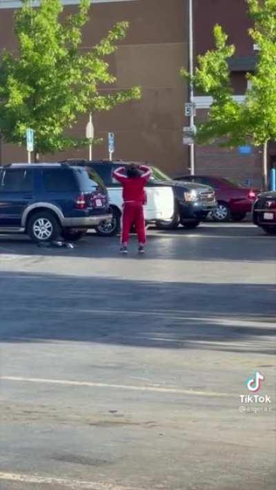 Man getting arrested in a parking lot was dressed ready