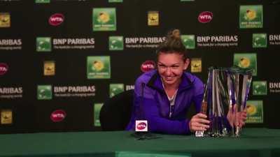 to lift the newly won trophy