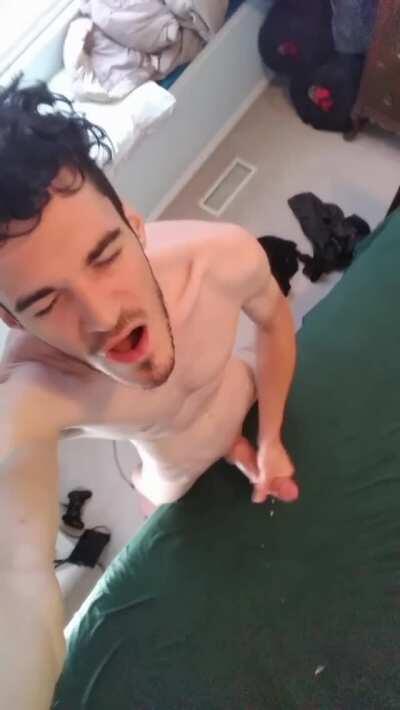 Big Dick stud lubes up his cock and explodes all over the bed