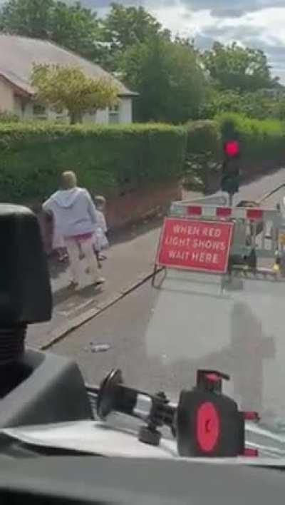 Pedestrian stops for temporary traffic lights set up to control traffic