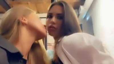 Kissing her girlfriends