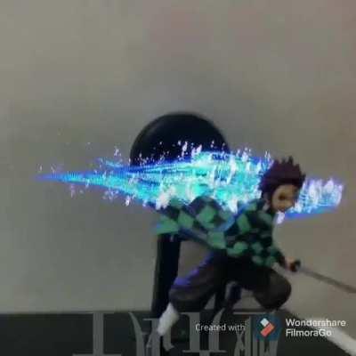 Demon Slayer figure with an animated background