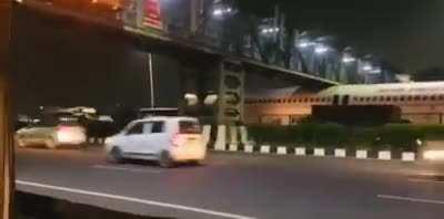 Plane stuck under a footaver bridge near IGI