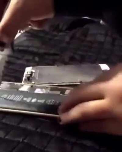 tries to open up a battery.... With a knife