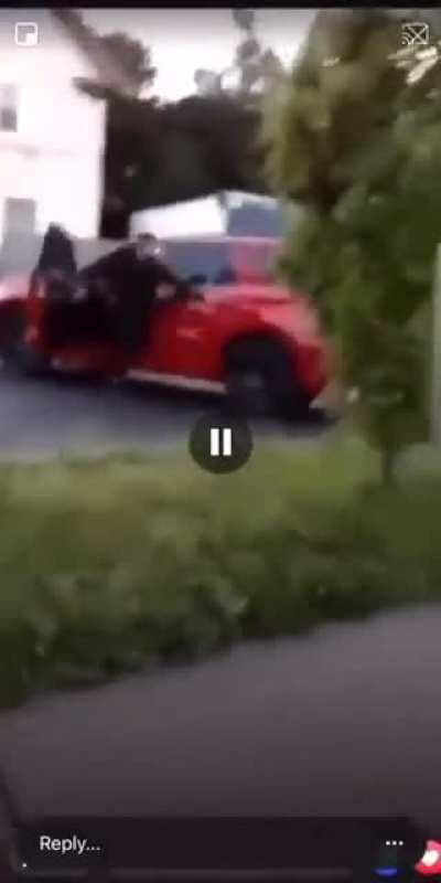 Owner Protecting his shop from protestors.