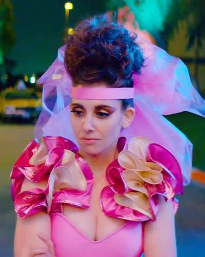 Blue-eyed beauty in a low-cut pink top in GLOW (2019)