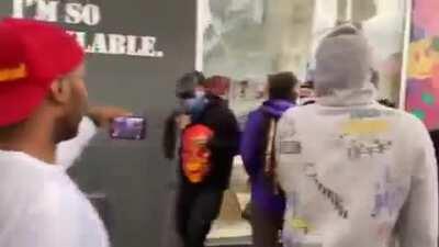 Los Angeles high end art store on Melrose being looted...