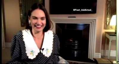 Lily James showing her foot at the camera