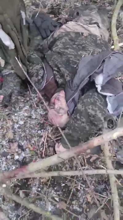 Russian soldiers examine the torn bodies of their comrades after an FPV drone attack on their position in Donetsk Oblast. Part 2
