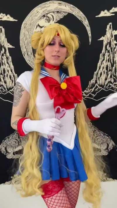 Sailor Moon playing with her wand