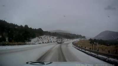 Towing a trailer too fast on an icy mountain road. My hat's off to the semi truck for seeing it coming and stopping in time. Everyone was ok. NSFW tag for language.