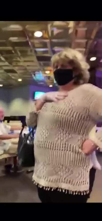 Karen lets her stupid show by questioning 2 men about why they aren't wearing mask while eating