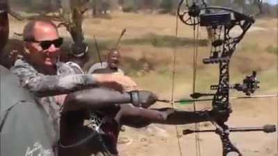 American archer shows modern bow to hunting tribe, proceeds to hit target