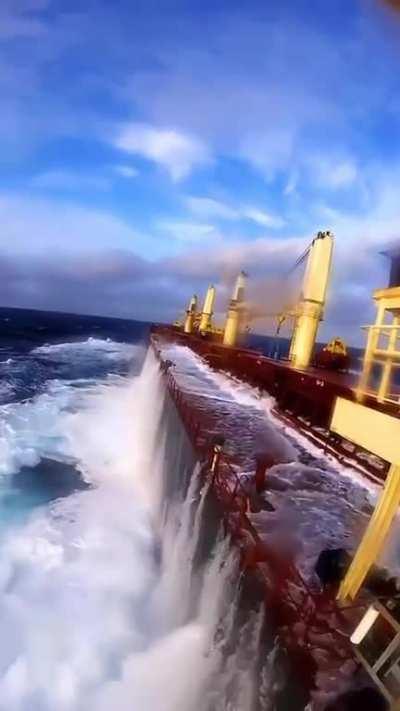 Huge cargo ships went nearly submerged because of heavy waves.