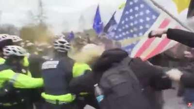 Black cop punches terrorist after words are exchanged at Trump Rally