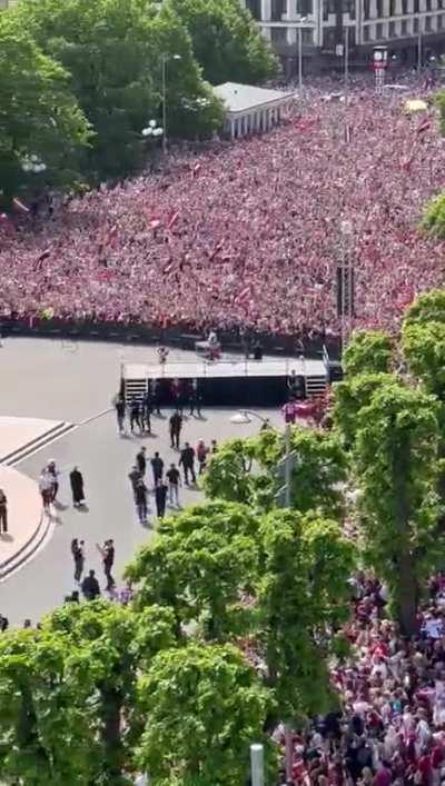 Latvian fans waiting for their team at the Freedom Monument, Riga. This achievement is unbelievable for the whole country.