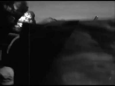 Cameraman perfectly shows a Japanese A6M Zero get torn up by AA fire while trying to do a kamikaze attack on US carrier