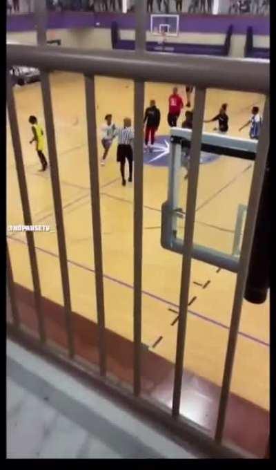 Kids brutally gang up on basketball referee after the game.