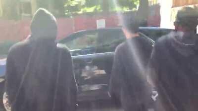 Antifa protestors smash up car which contains a dog and someone they believe to be their political enemy