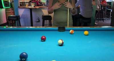 Having a little fun while playing pool.