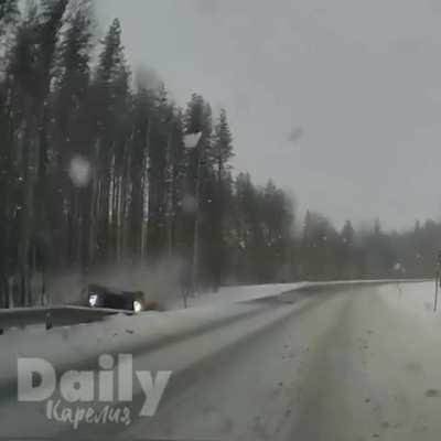 Tanker rolls off a snowy road