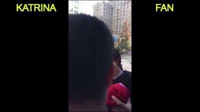 Girl booing Katrina in a public place