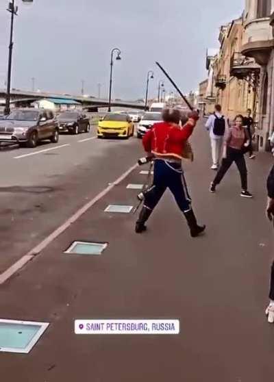 Likely drunk Russian man fights off invisible attackers with sword