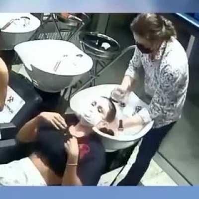 To wash a customers hair