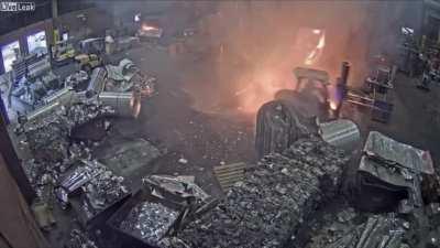 Foundry worker accidentally puts wet scrap metal in furnace