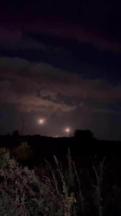 Nighttime M142 HIMARS launches towards Russian targets viewed from afar somewhere in eastern Ukraine