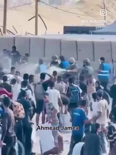 Israeli supported US Mercenaries pepper spraying starving Palestinians waiting for aid