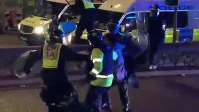 Police dog sees officer acting violently towards a protester and bites them at protests in the UK over new laws increasing police power during protests. Good doggy.