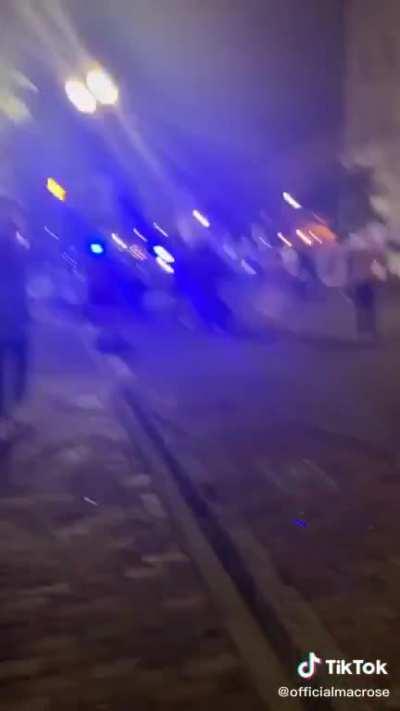 COPS PRETEND TO KNEEL TO DRAW PROTESTERS IN, THEN PROCEED TO SHOOT FIREWORKS AT THEM