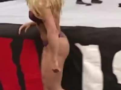 Trish Stratus in a purple bra and thong