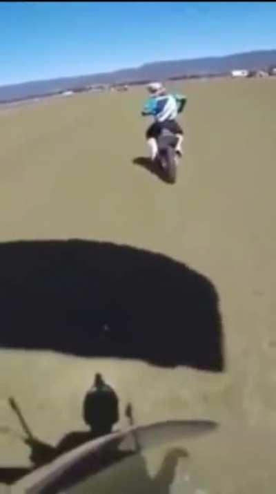 Skydiver lands on a moving motorcycle