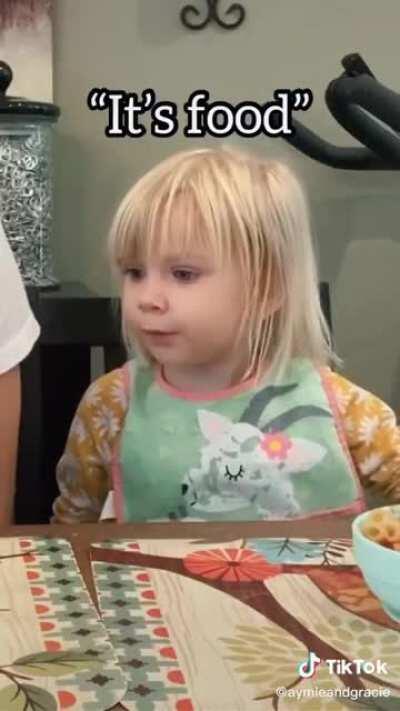 Pretending to not want to eat your food infront of the child