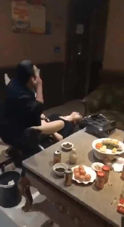 Japanese Couple in a Restaurant.