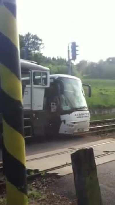 Bus Obstructing Railroad Crossing Gets Smashed by Train
