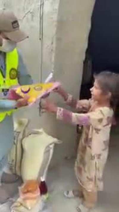 Street Children Pakistan beings Eid gifts for children.