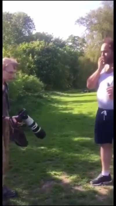 Pushing a photographer into the pond for a joke