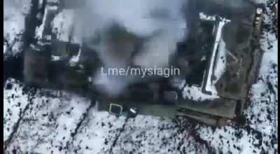 A Ukrainian drone destroying a Russian tank with a grenade on a string