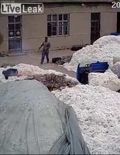 Using a lighter to open plastic bag at a COTTON WAREHOUSE..